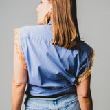 137 Camicia a quadretti blu taglio maschile con manica rielaborata con passamaneria arancio - TG S/M