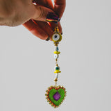 Orecchini ricamati a mano lunghi  con cuori pendenti e occhi di ceramica