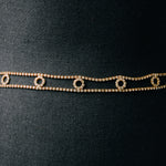 Cinturina gioiello con cerchi di strass bianchi su base dorata